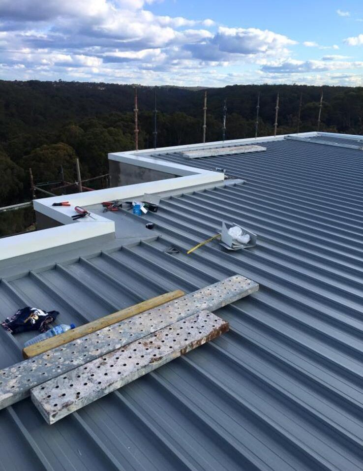 Roofer carrying out a roof leak repair